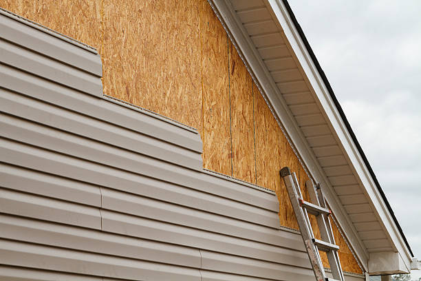 Professional Storm Damage Siding Repair technician working in Salem, IN